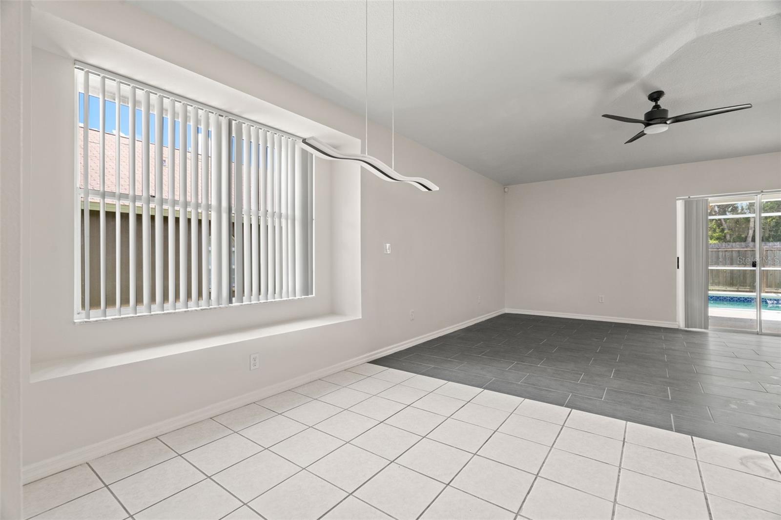 Convenient Breakfast Nook Between Large Living Room and Family Room.