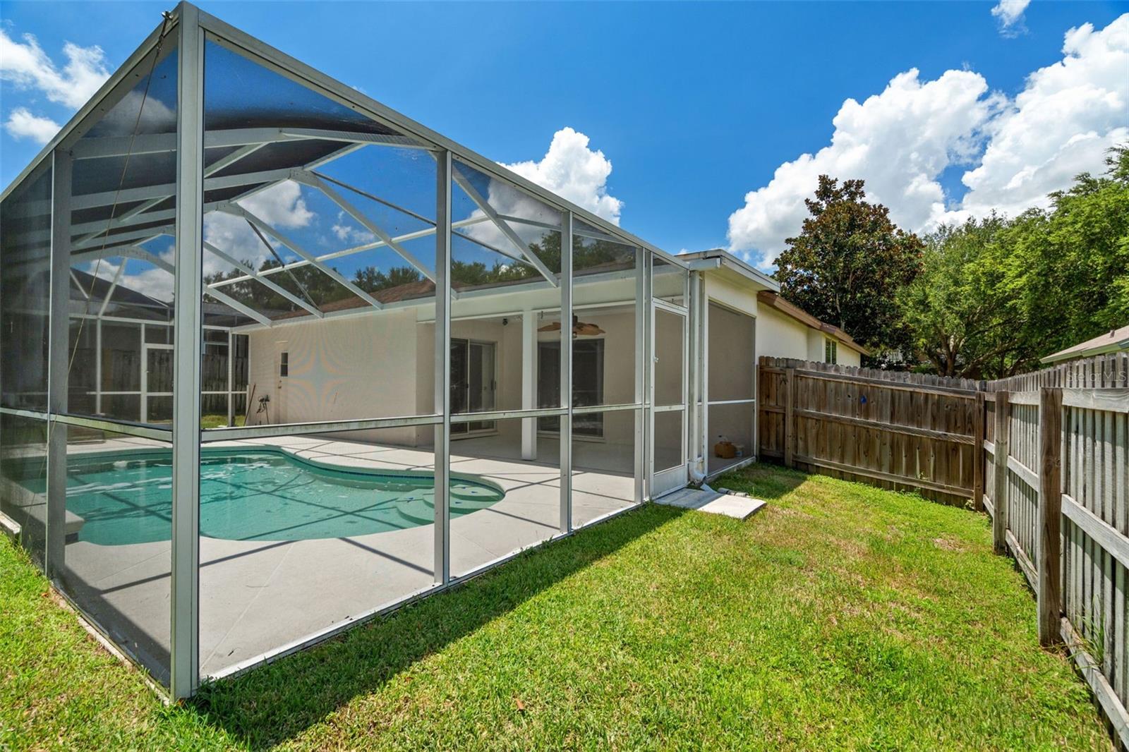 Fully Fenced in Back Yard, Great for furry friends and young ones, Screened in Pool