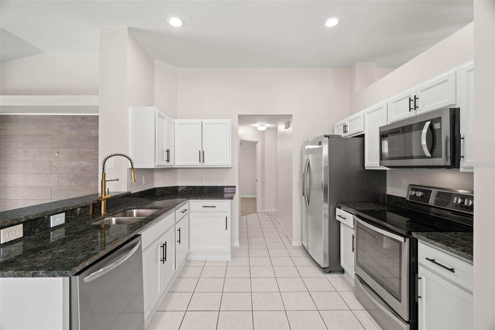 Complete Kitchen Remodel and Update  with Granite Countertops, Brand New Stainless Steel Appliances, High End Fixtures, New Garbage Disposal.