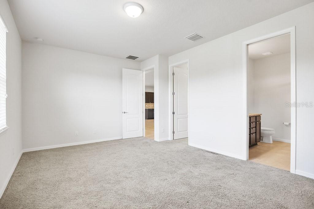 Primary bedroom at rear of home