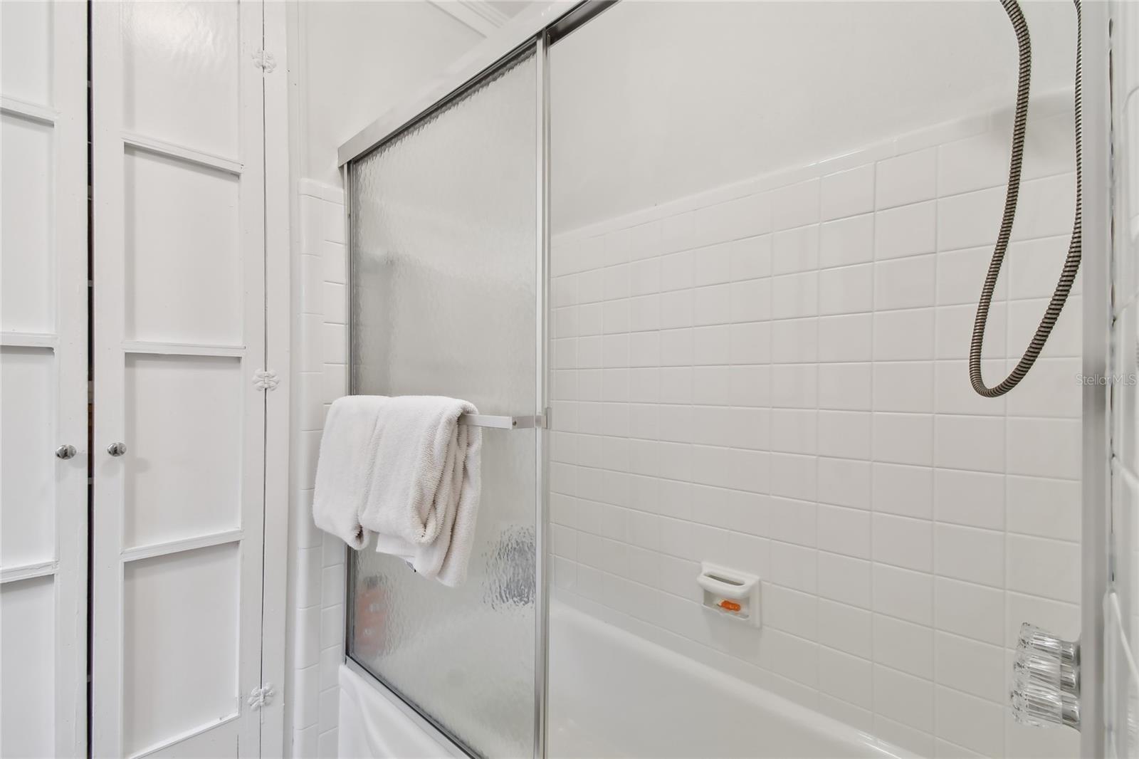 Tub with shower in 2nd bedroom ensuite.