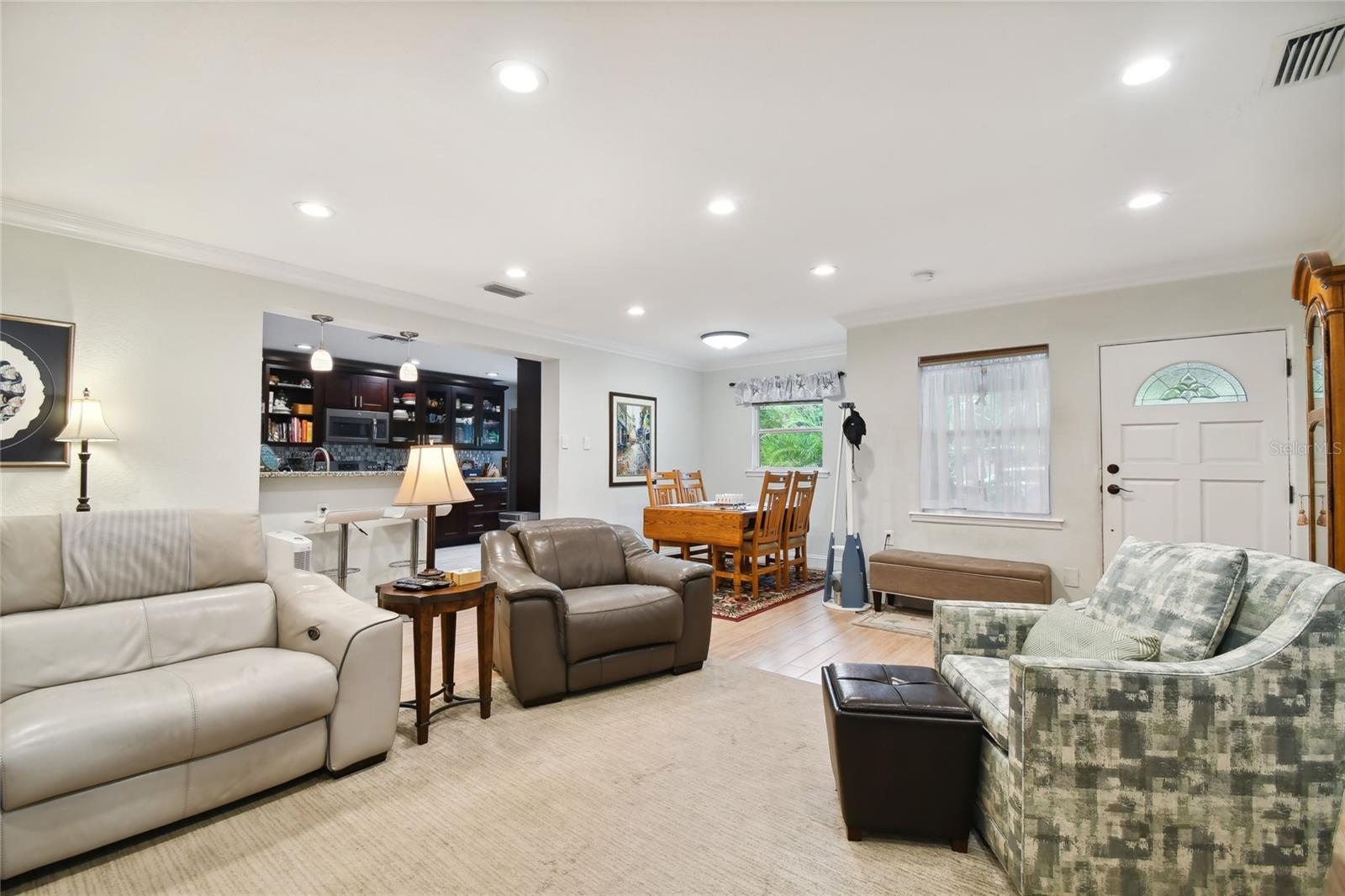 View of entrance, dining area and kitchen from the family room.