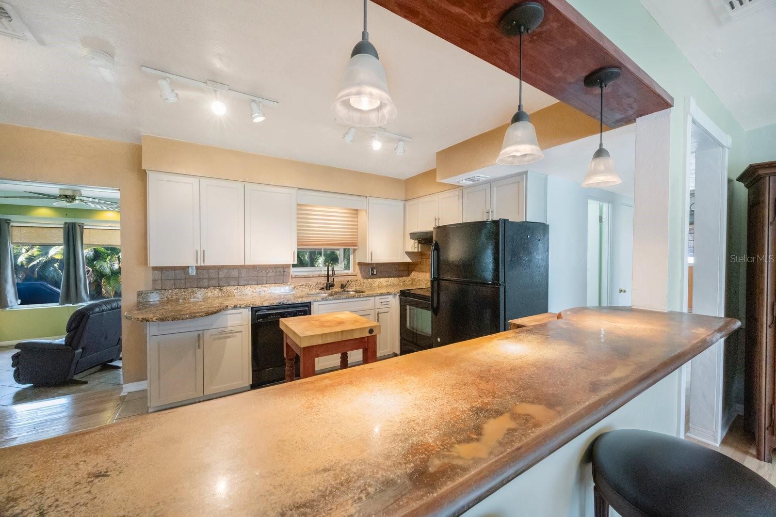 Kitchen featuring bar for entertaining