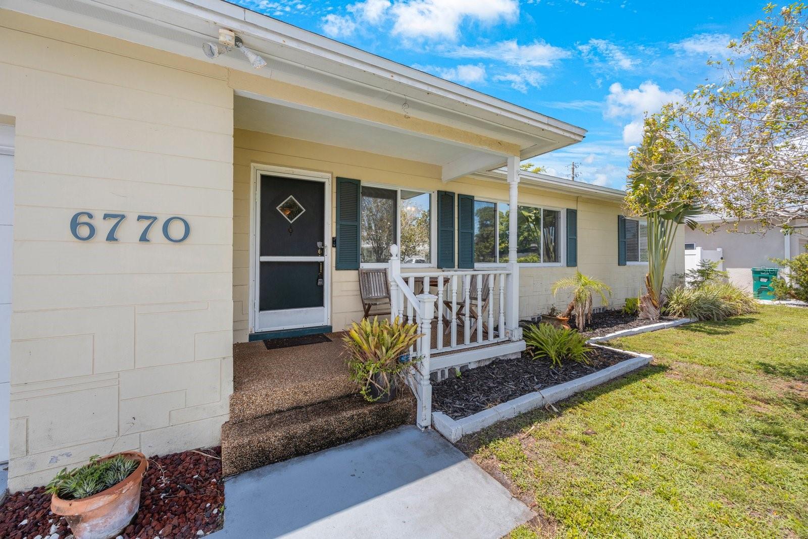 Front entrance featuring covered patio