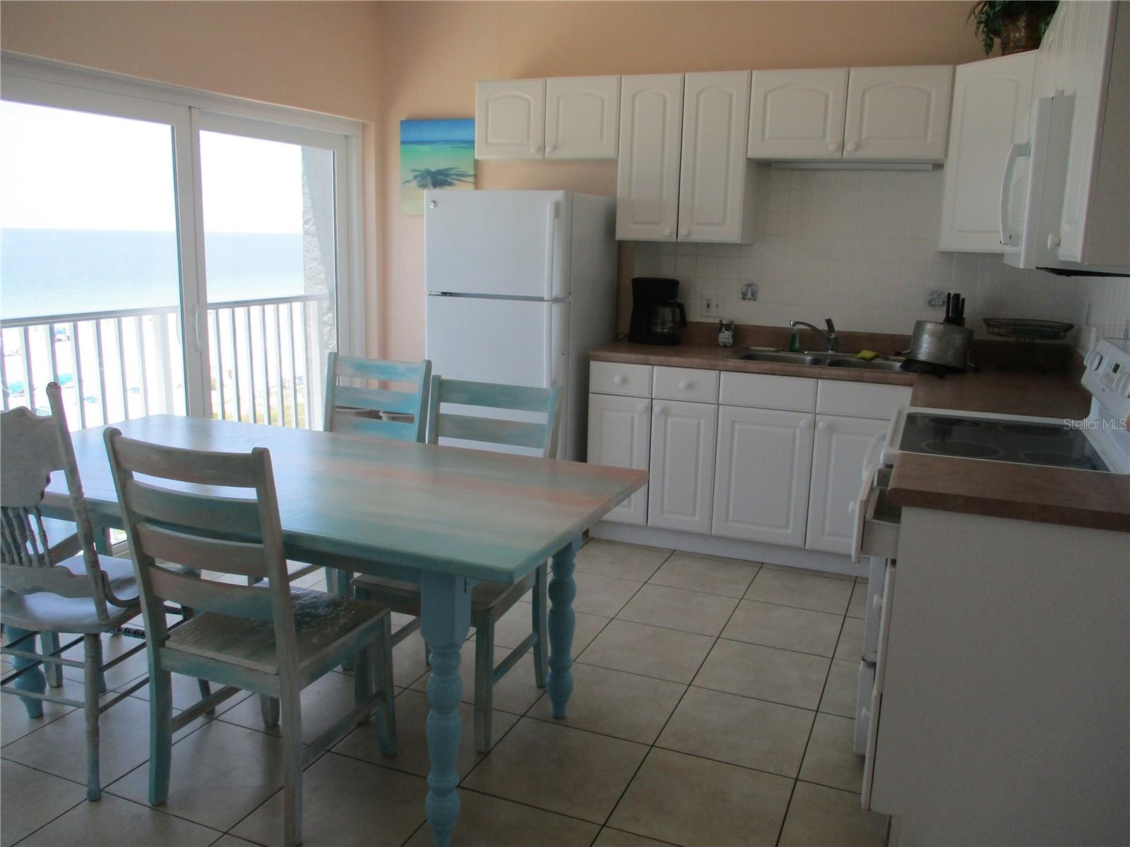 Full Kitchen. High impact sliding doors.