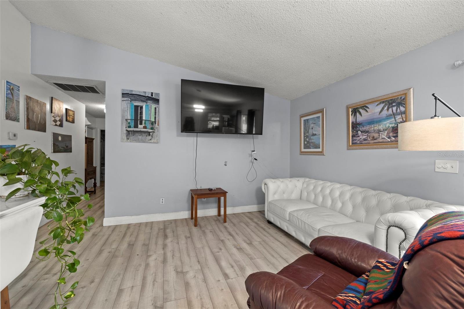 High Ceiling & New Flooring Throughout the Home