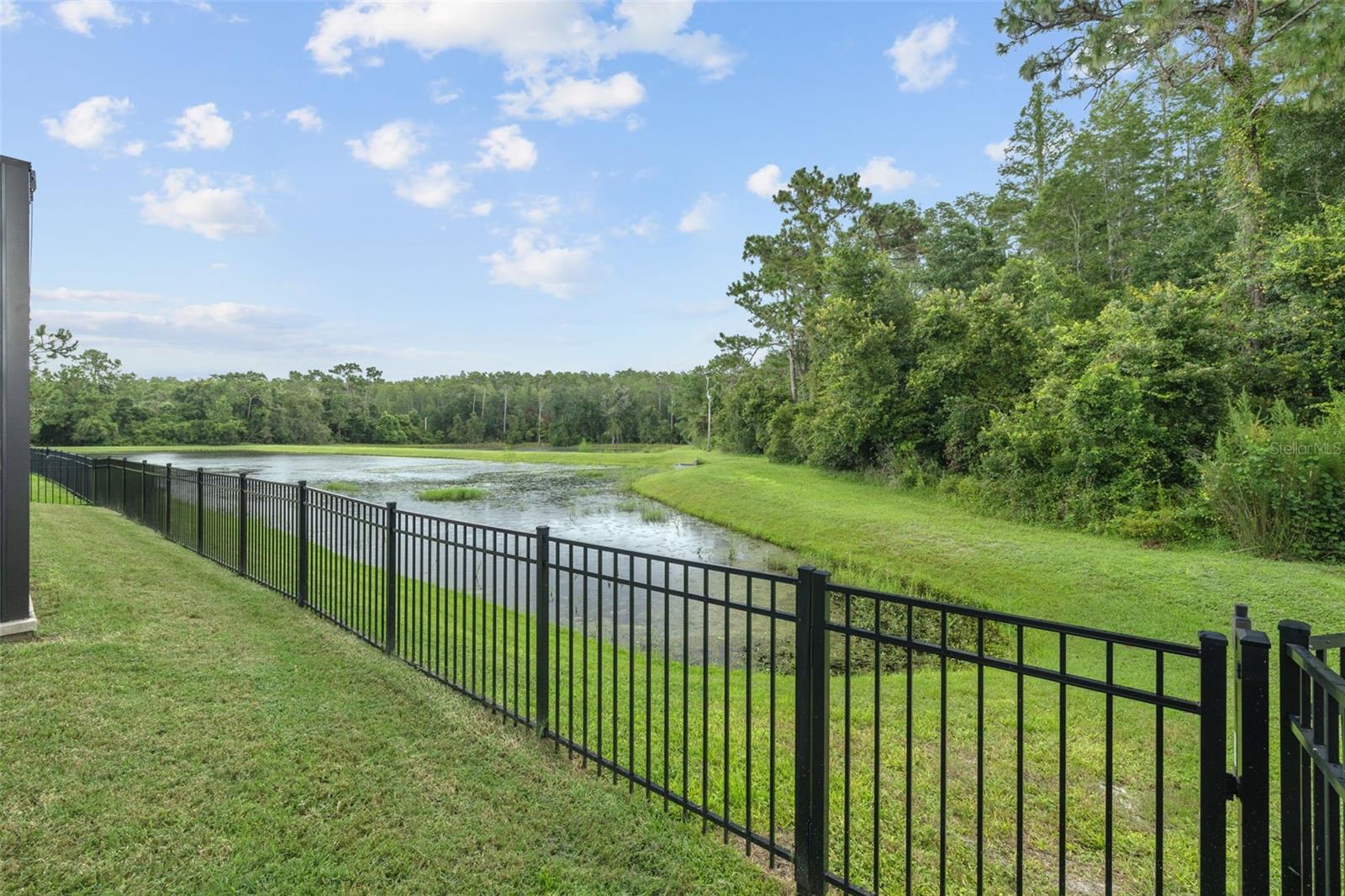 Private fenced yard with water view