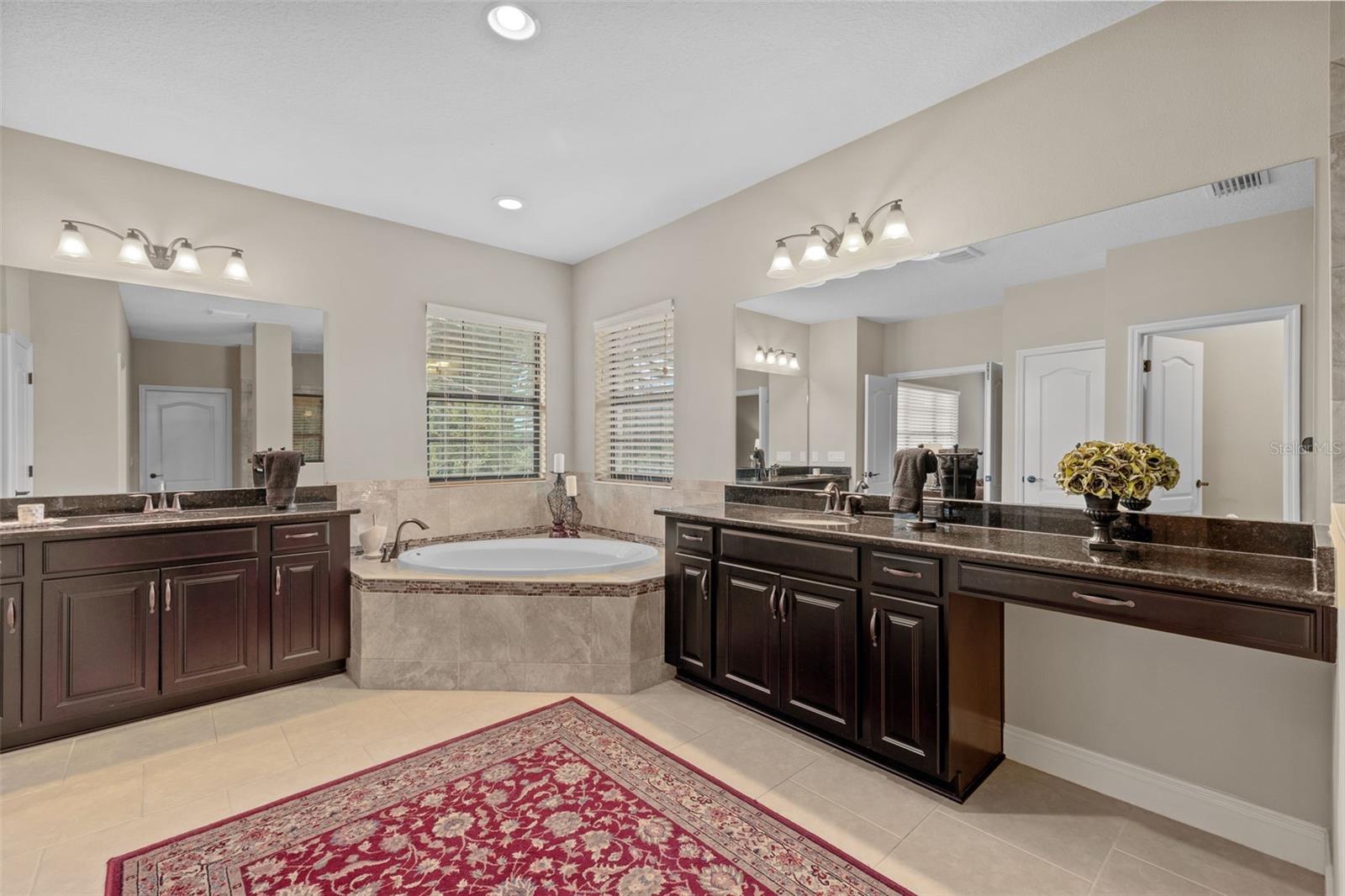 Ensuite primary master bath with split vanities