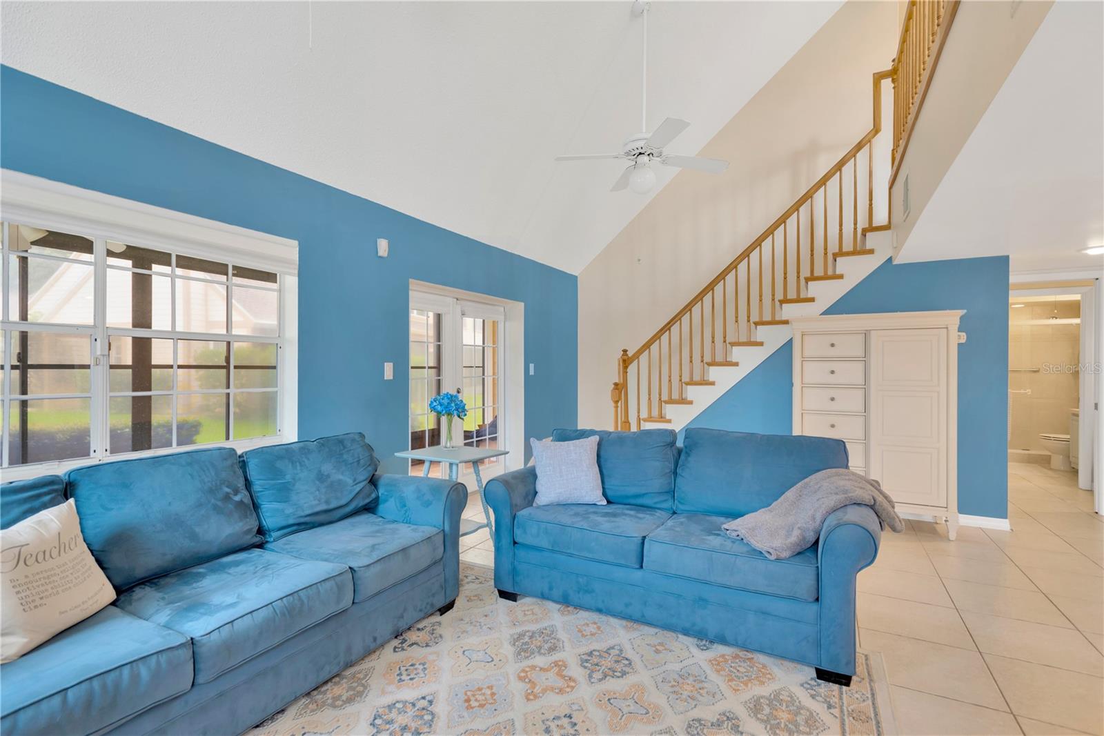 View of Living Room and Stairway to Open Loft Bedroom, 2nd Bedroom & Full Bathroom.