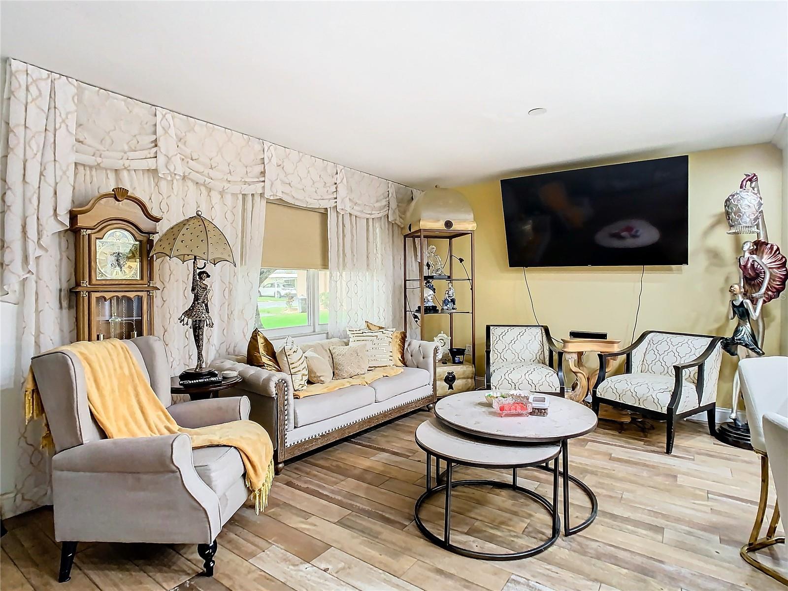 living room with new ceramic wood tile floors