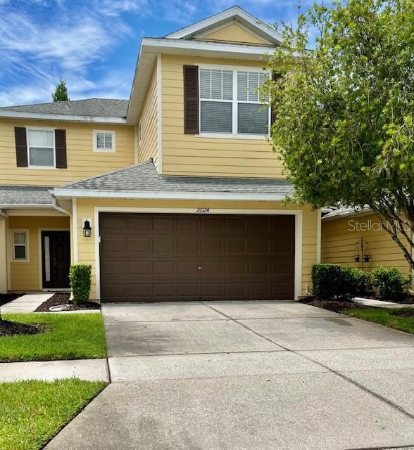 Front with Large 2 Car Driveway and garage