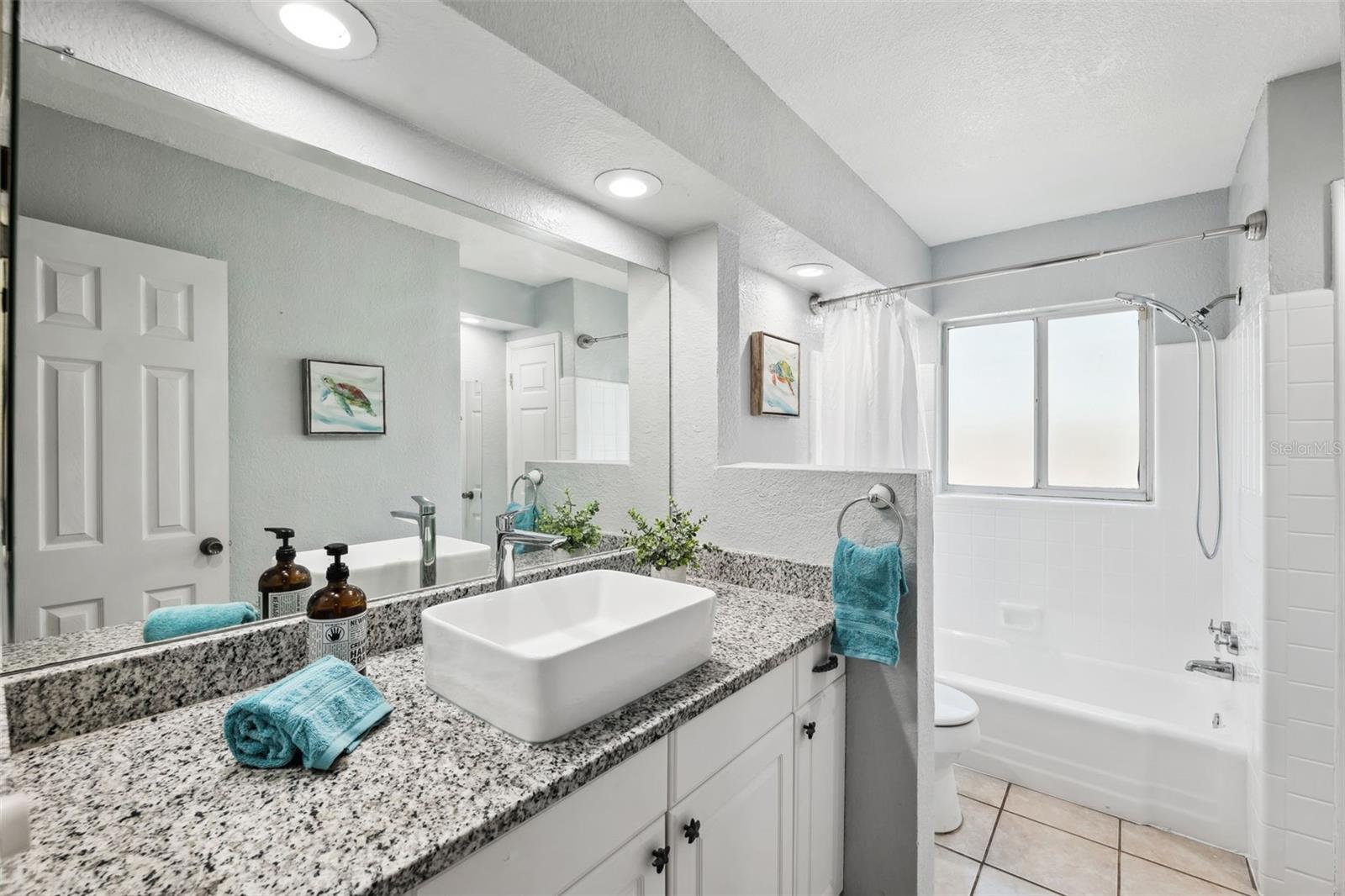 Roomy main bath with tub and linen closet