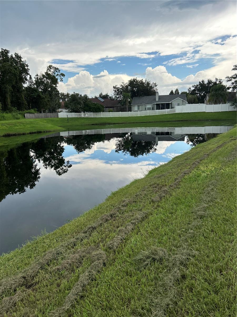 pond to the right of  house