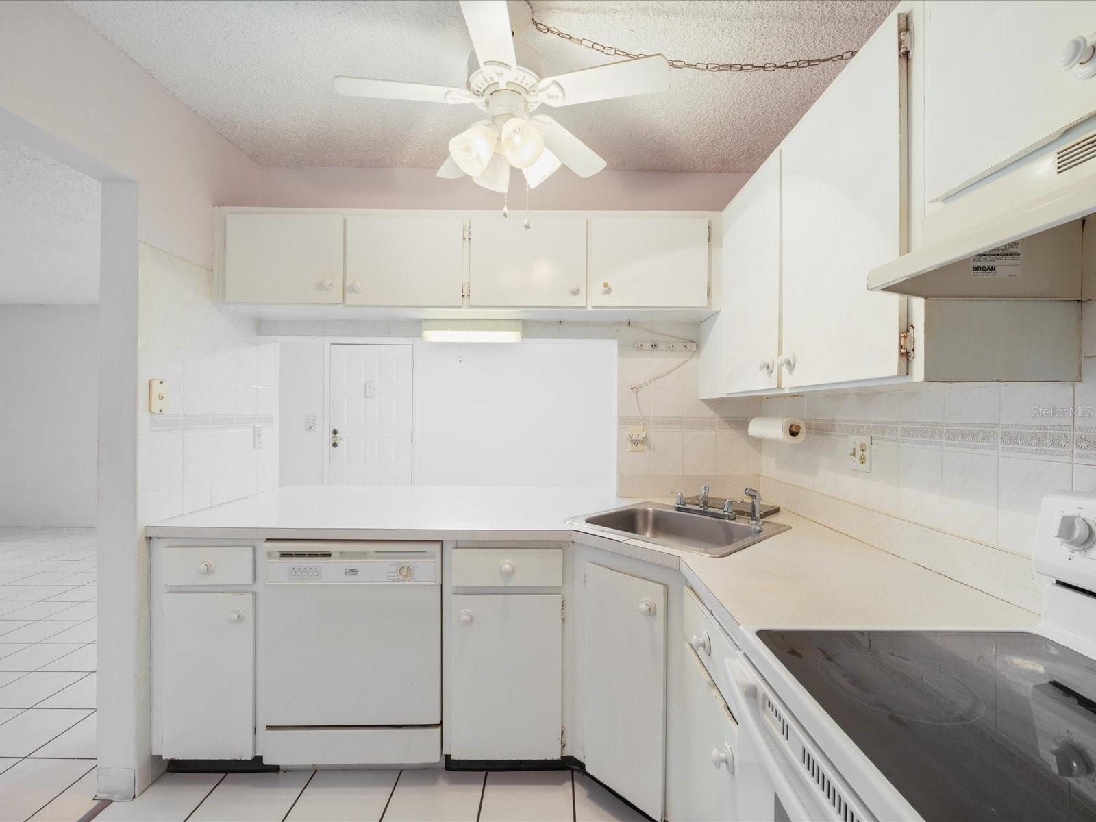 Kitchen view with pass through to dining room area