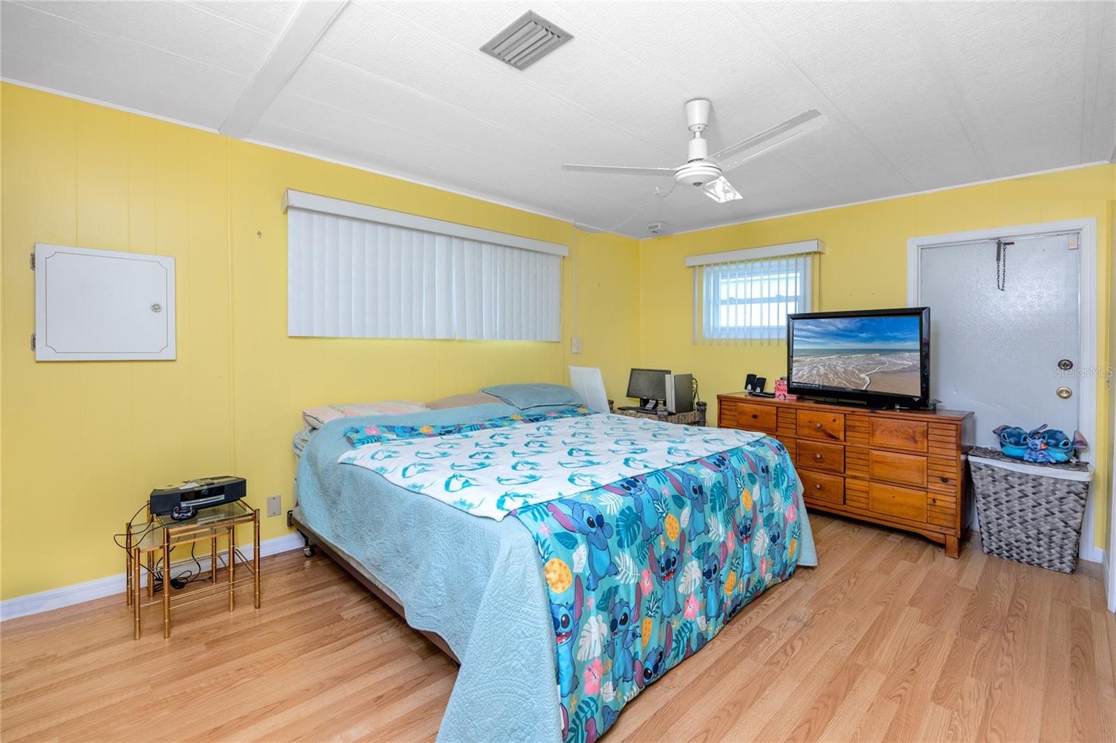 Large primary bedroom that easily fits a king sized bed with ample space left over, ensuite bathroom, and walk-in closet.