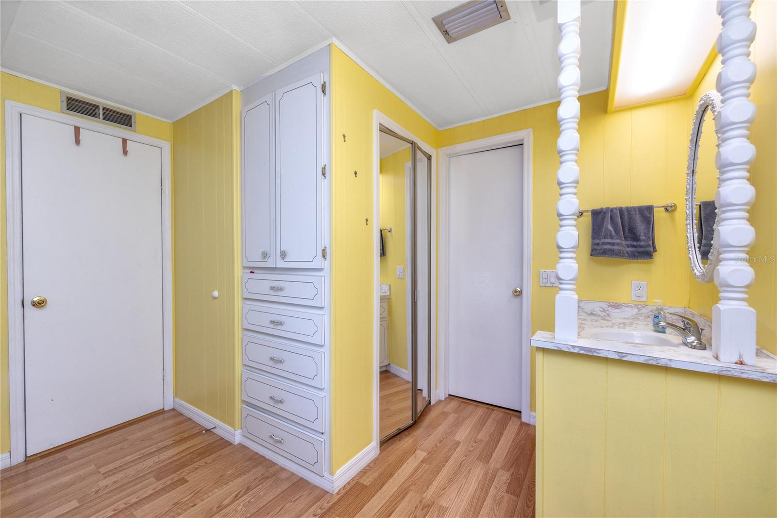 Built in storage, linen closet, and vanity outside rest of the bathroom making getting ready in the morning a breeze for more than two people.