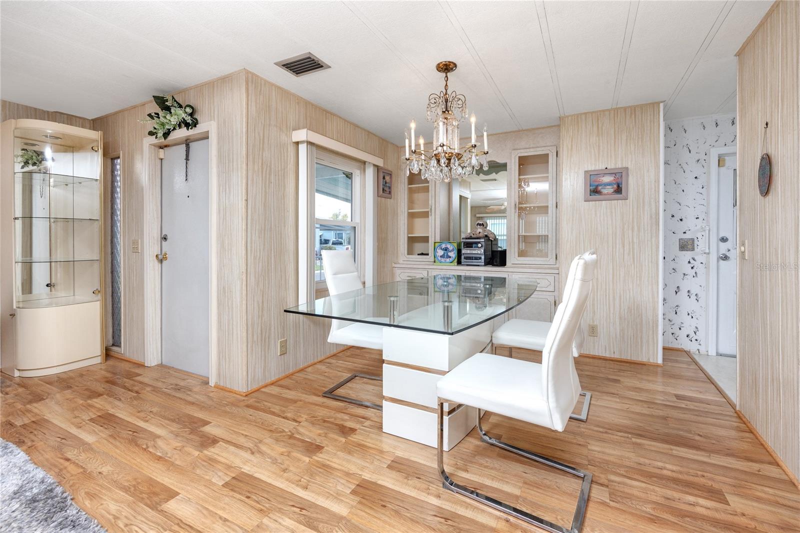 Dining area with built in cabinetry & natural light.