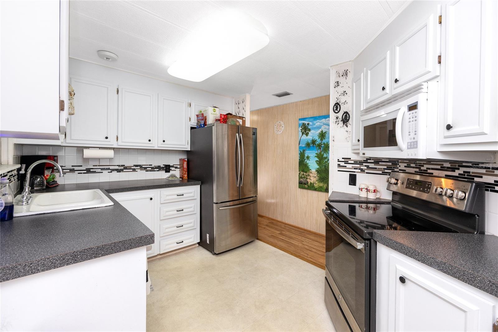 Bright open kitchen with stainless steel appliances