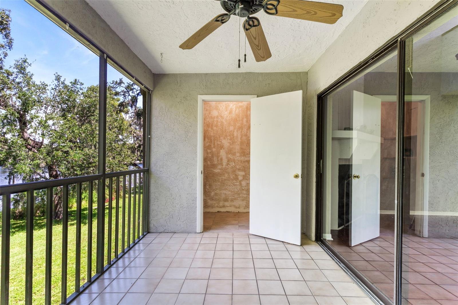 Screened in balcony with storage closet