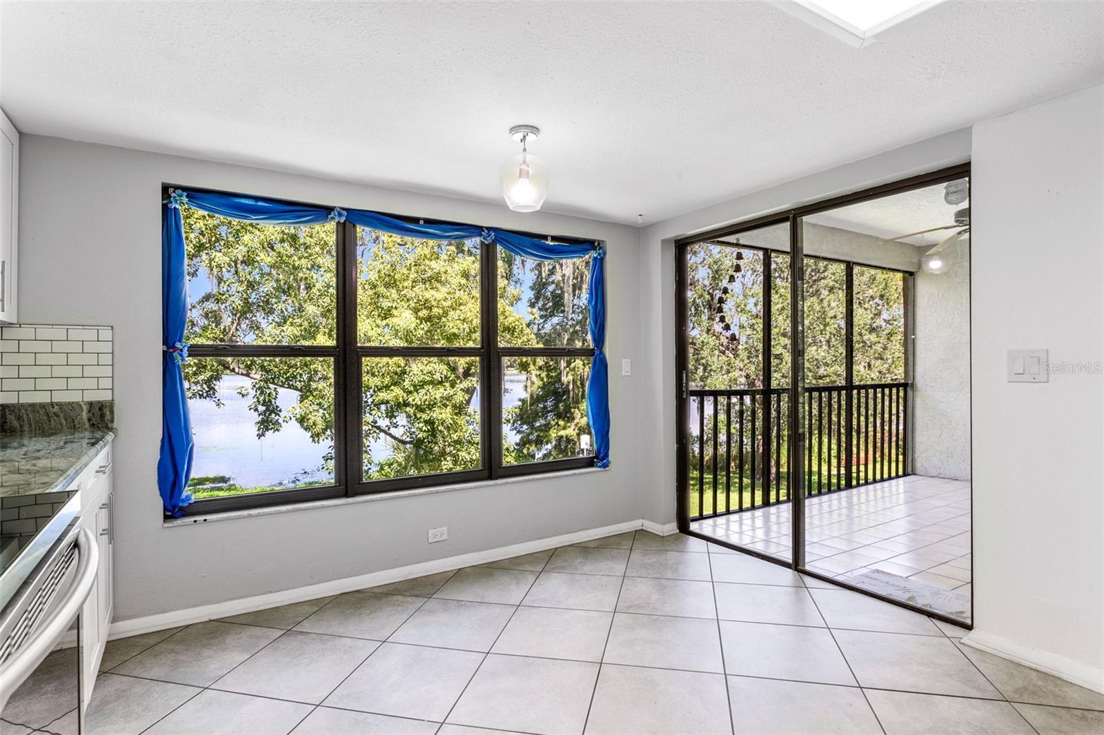 Kitchen with Sliding Doors to Screen In Balcony