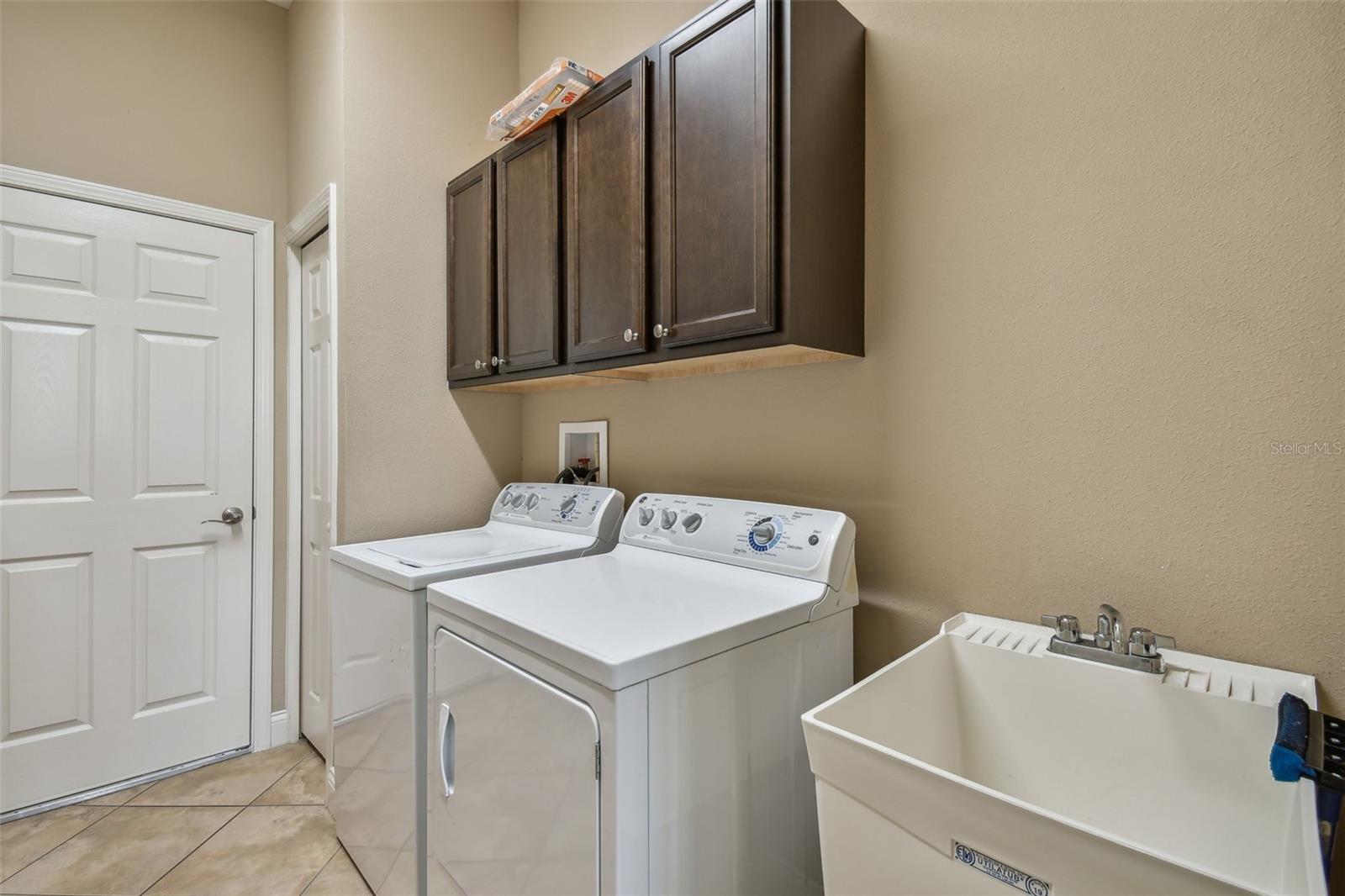 Laundry Room with storage and utility sink