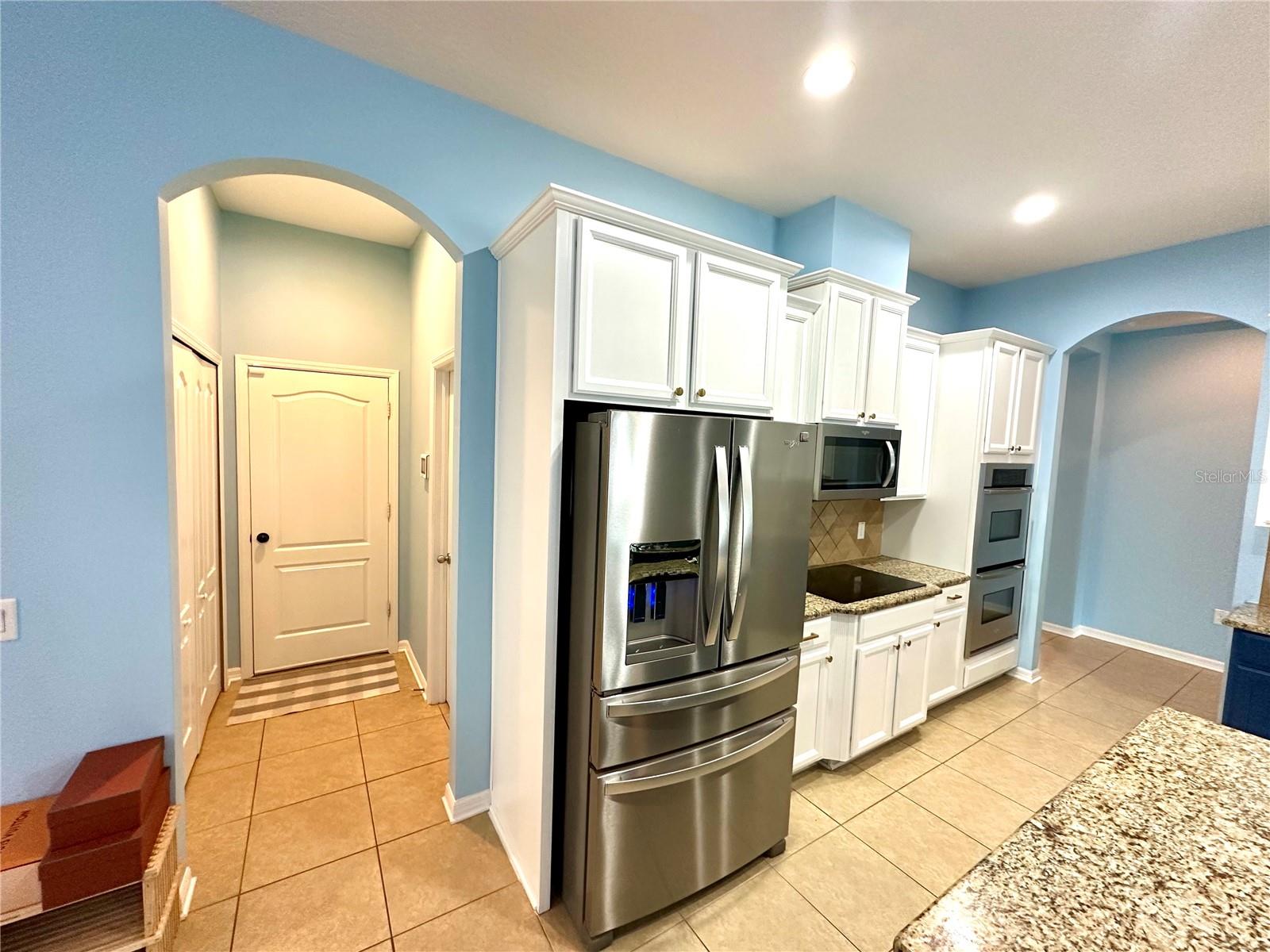 Entrance to garage, pantry to left, laundry to right