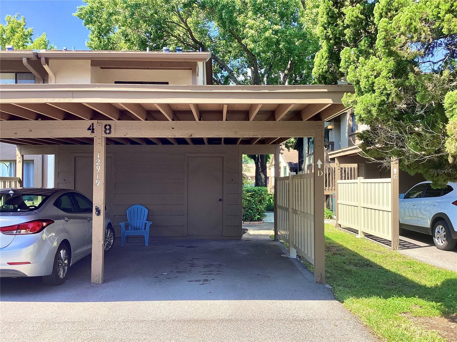 Covered parking with private storage closet.