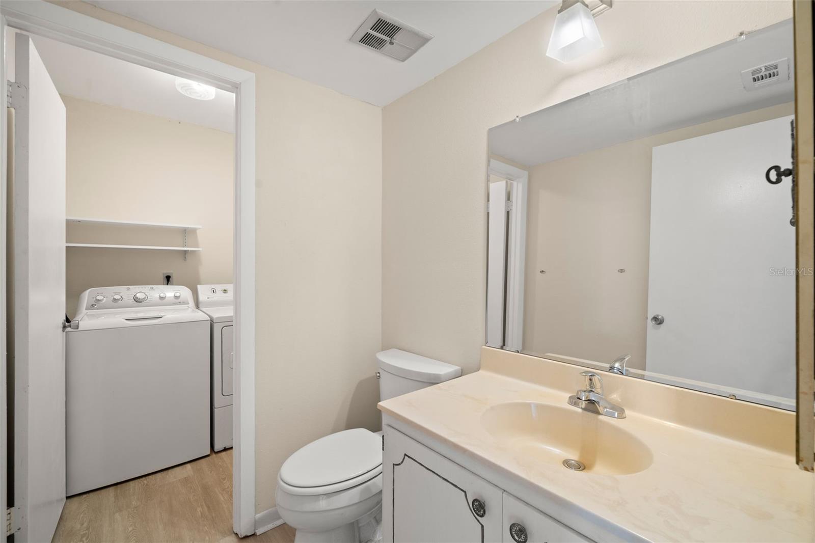 main floor powder room and attached laundry closet