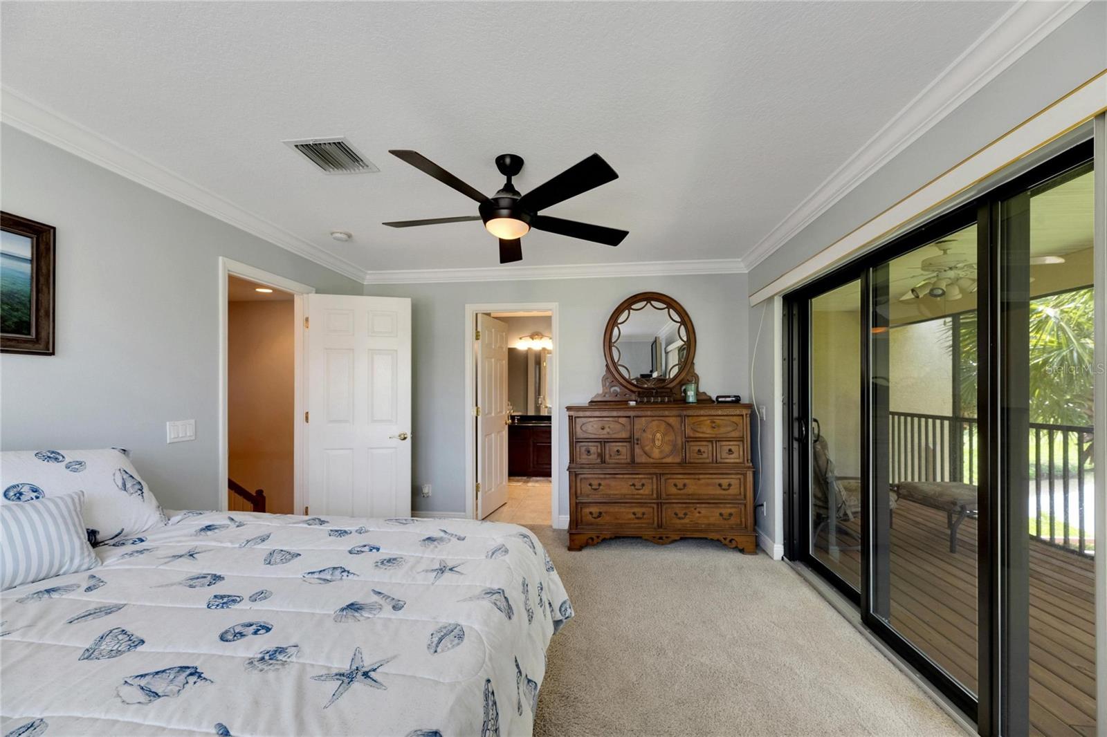 Primary Ensuite Bedroom with Screened Lanai/Waterview