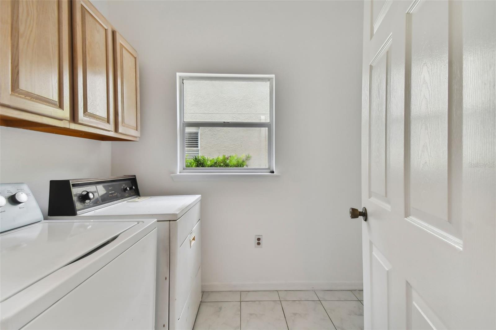 Laundry Room off Kitchen Leads to Garage