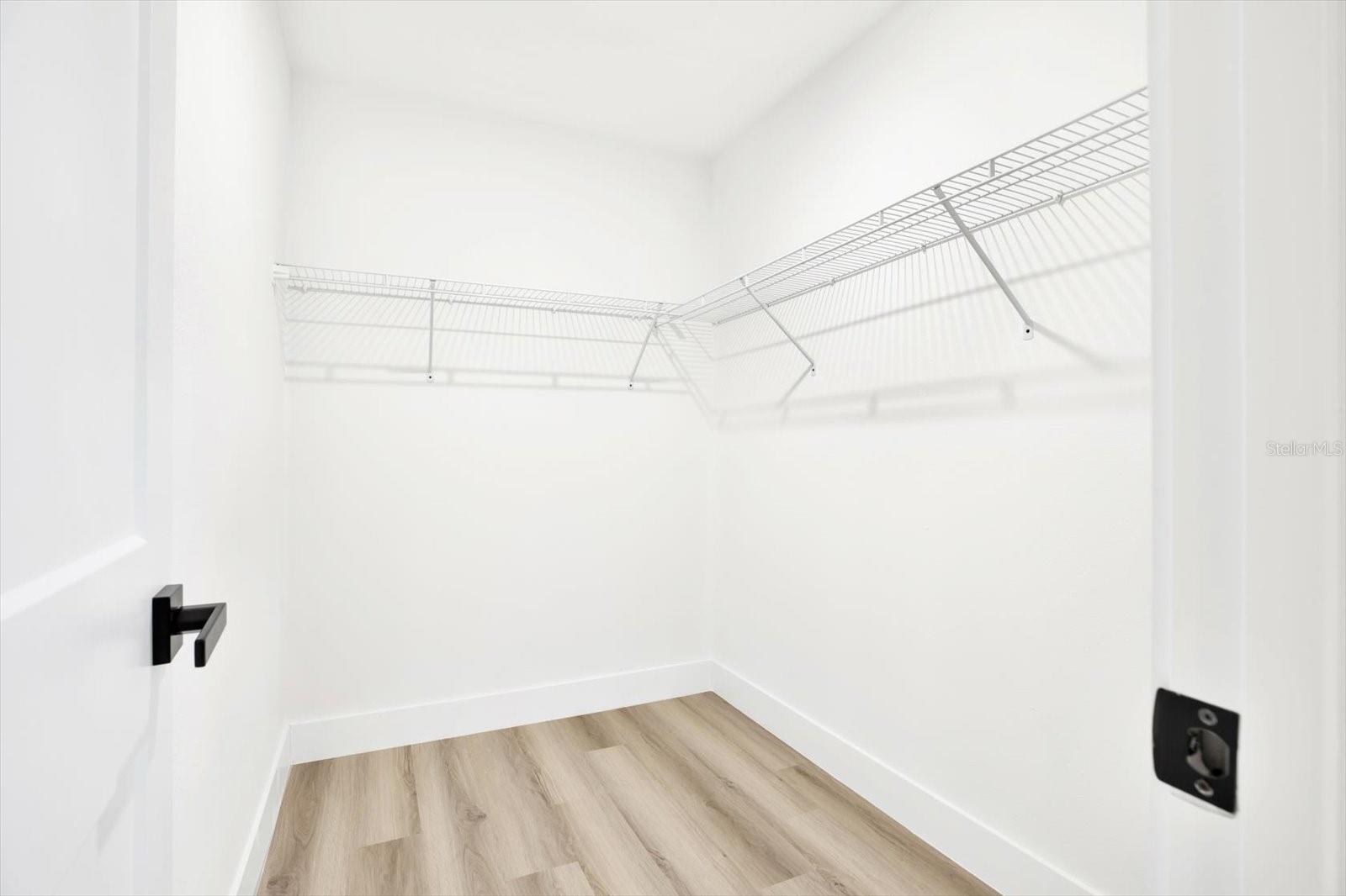 Primary bedroom walk-in-closet