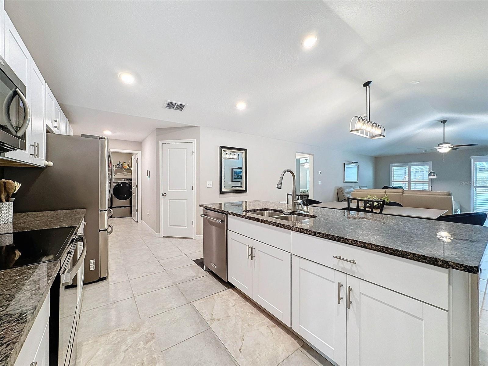 LOVELY WHITE CABINETRY AND TILE FLOORS