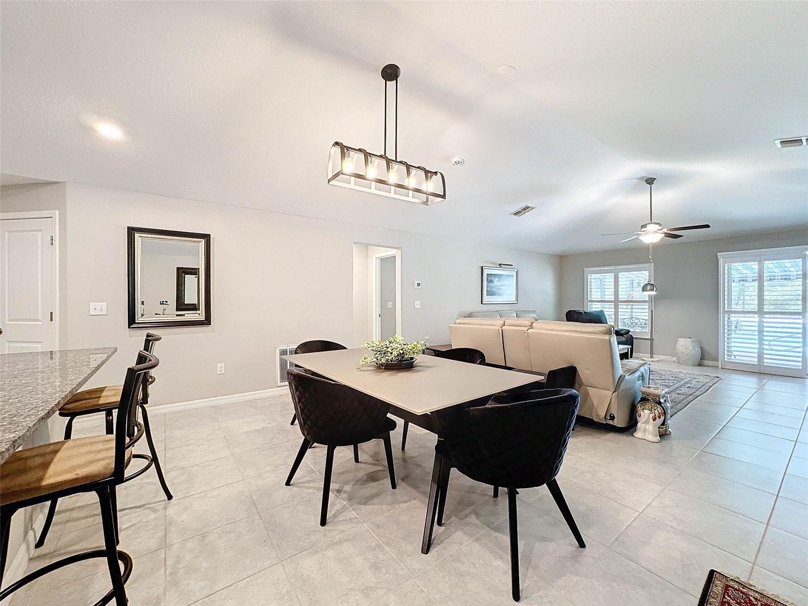 DINING AREA WITH SHARED SPACE TO MAIN PART OF HOME