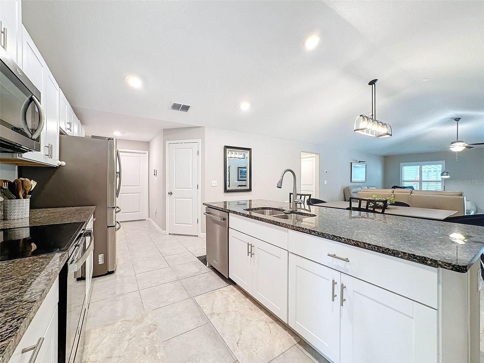 GORGEOUS GOURMET KITCHEN WITH GRANITE COUNTERTOPS AND STAINLESS STEEL APPLIANCES