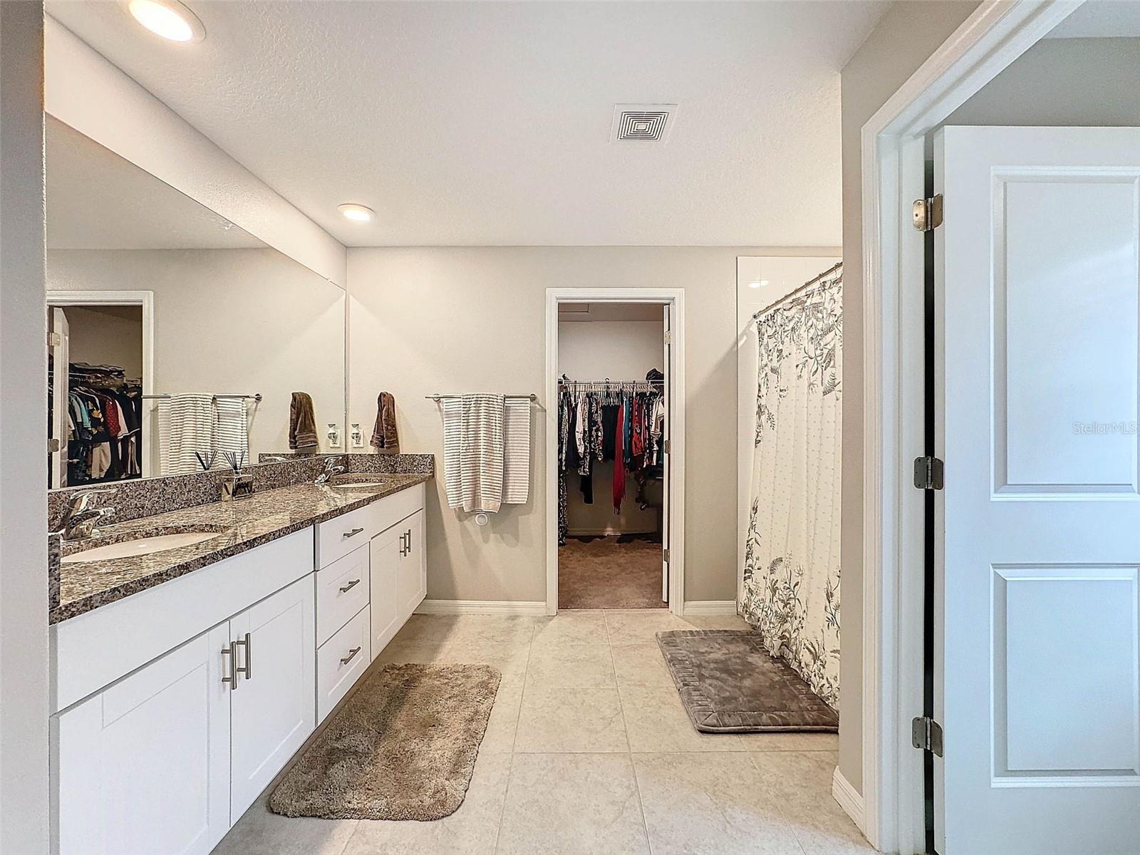 WHITE CABINETRY AND GRANITE TO MATCH THE KITCHEN AND OTHER BATH IS SO BEAUTIFUL