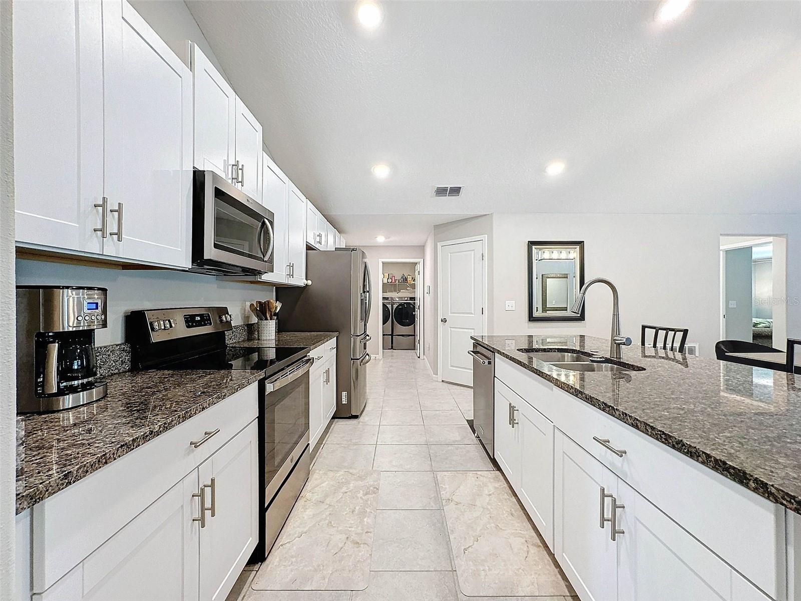 IMPRESSIVE KITCHEN! OPEN FLOORPLAN AND VAULTED CEILING FOR THIS BRIGHT BEAUTIFUL HOME