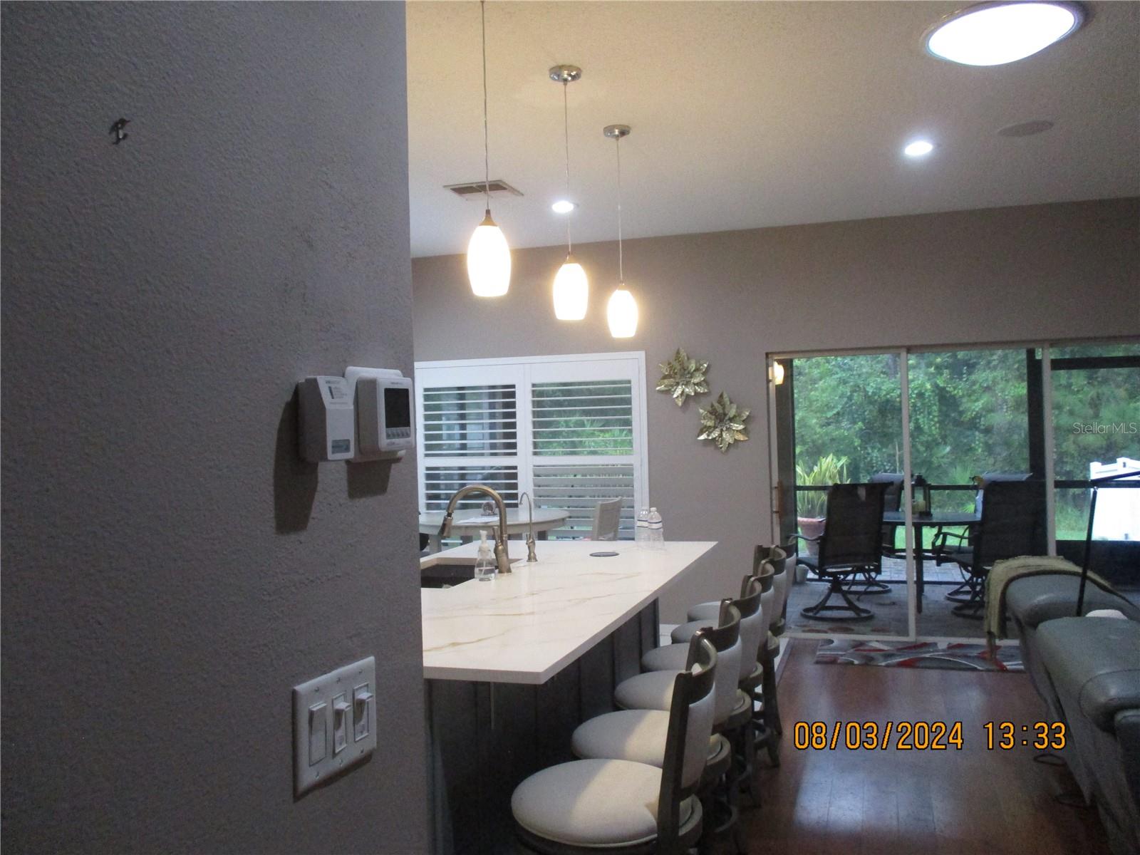 Six bar stools fit easily at kitchen island