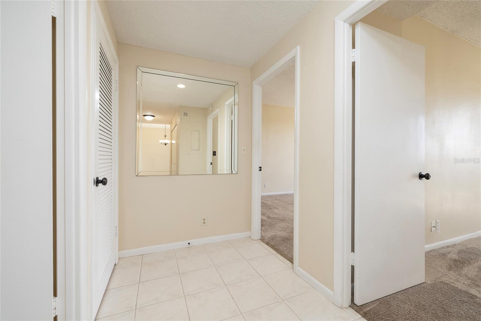 Hallway to Bedrooms -- Laundry Closet on the left