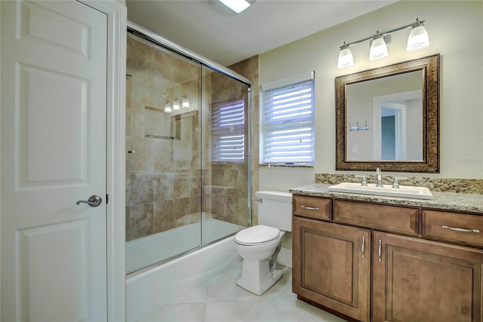 Guest bathroom with walk-in shower.