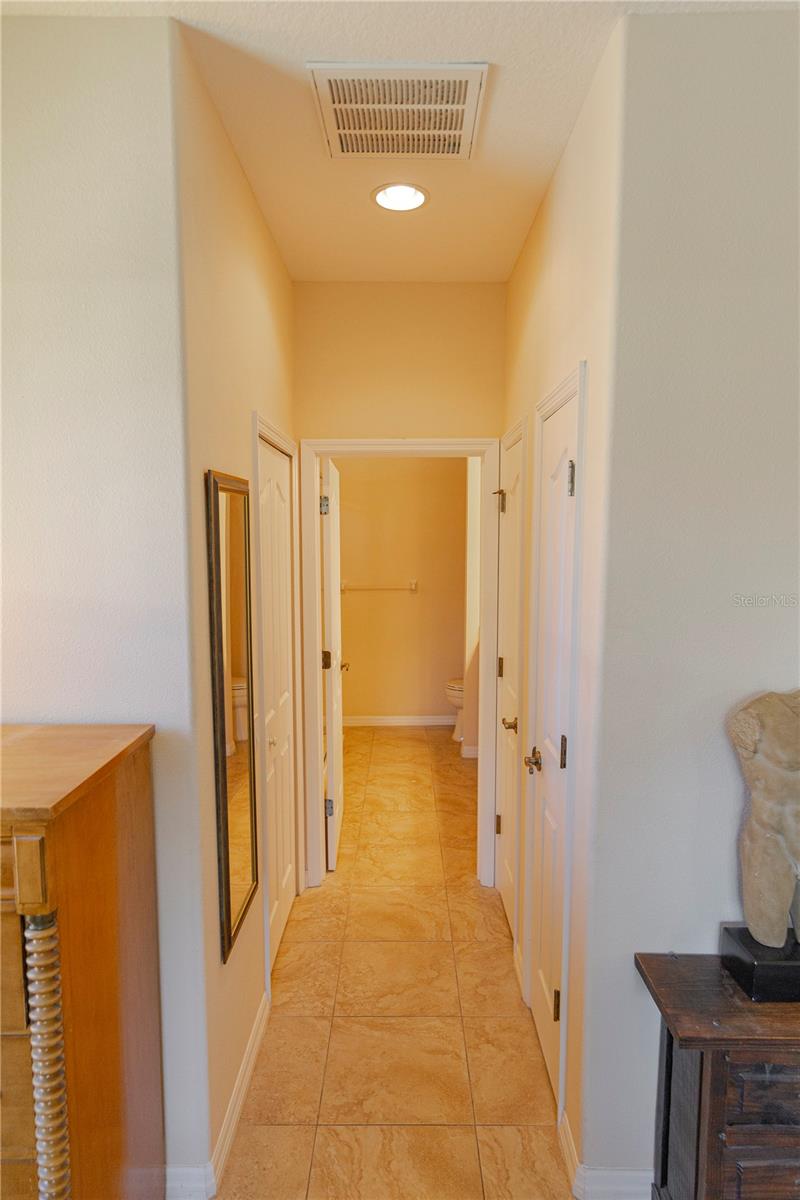 Hallway from Master BD to Master Bath, Walk-in closet, 2nd closet and linen closet.