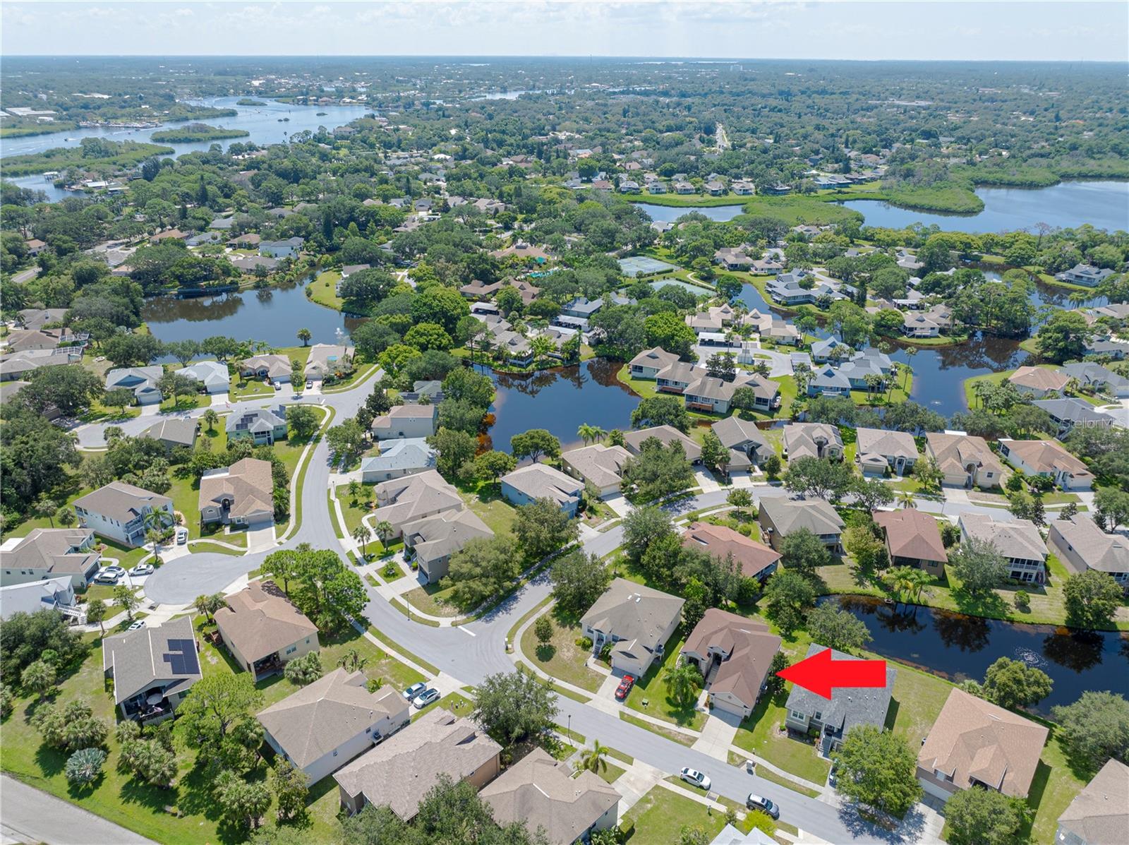 AERIAL overlook of Pointe Alexis Clubouse, pool, tennis & pickle courts