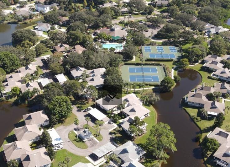 AERIAL overlook of Pointe Alexis Clubouse, pool, tennis & pickle courts