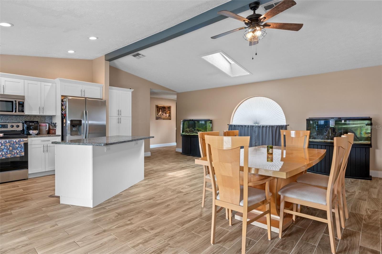 Dining/Kitchen Combo with Wood Look Tile Flooring