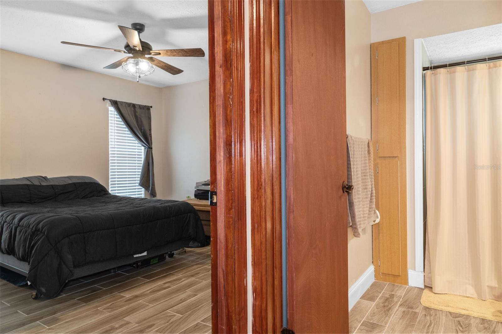 Bedroom 4 with Wood Look Tile Flooring