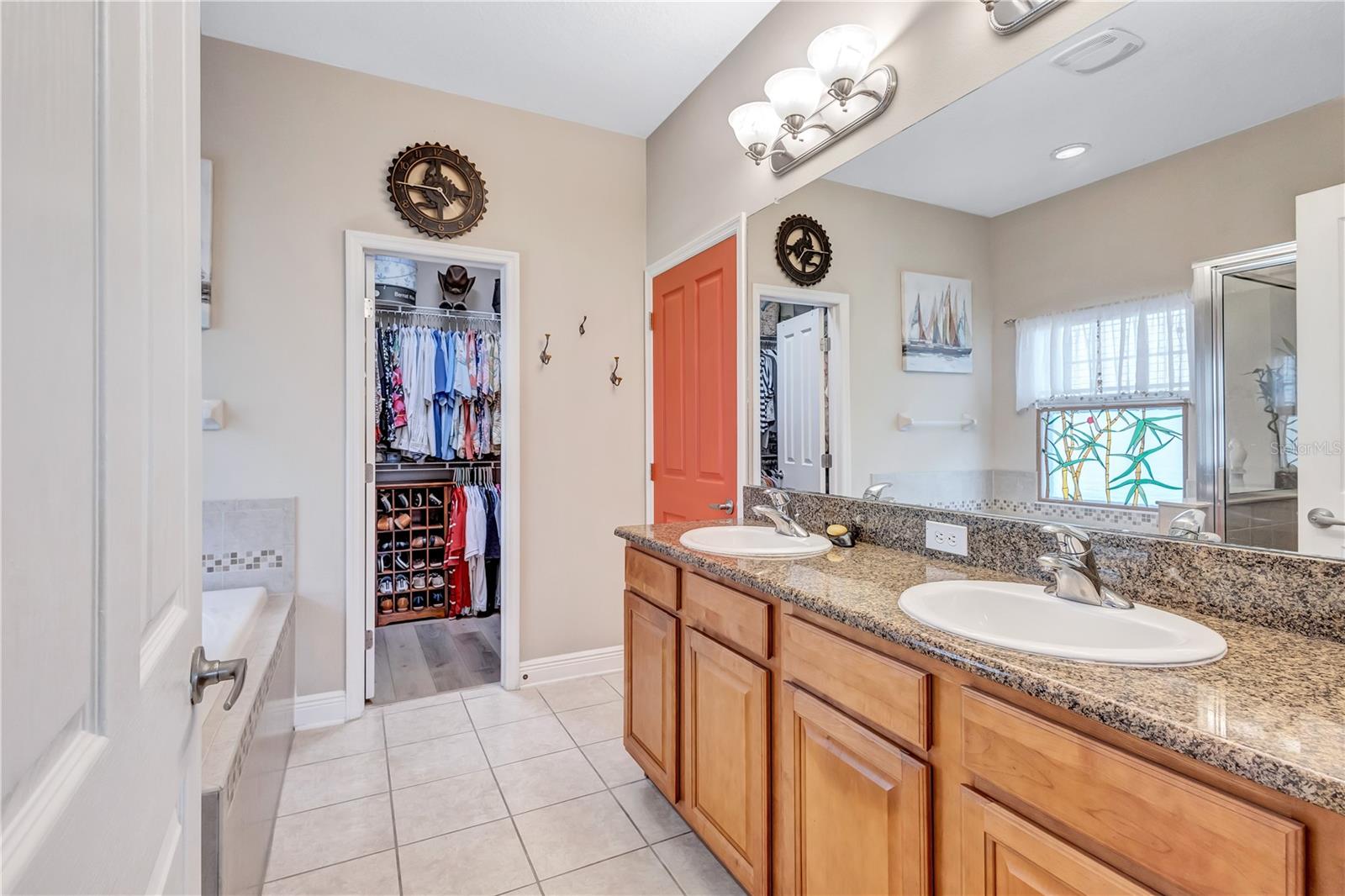 Ensuite primary bathroom with double vanities