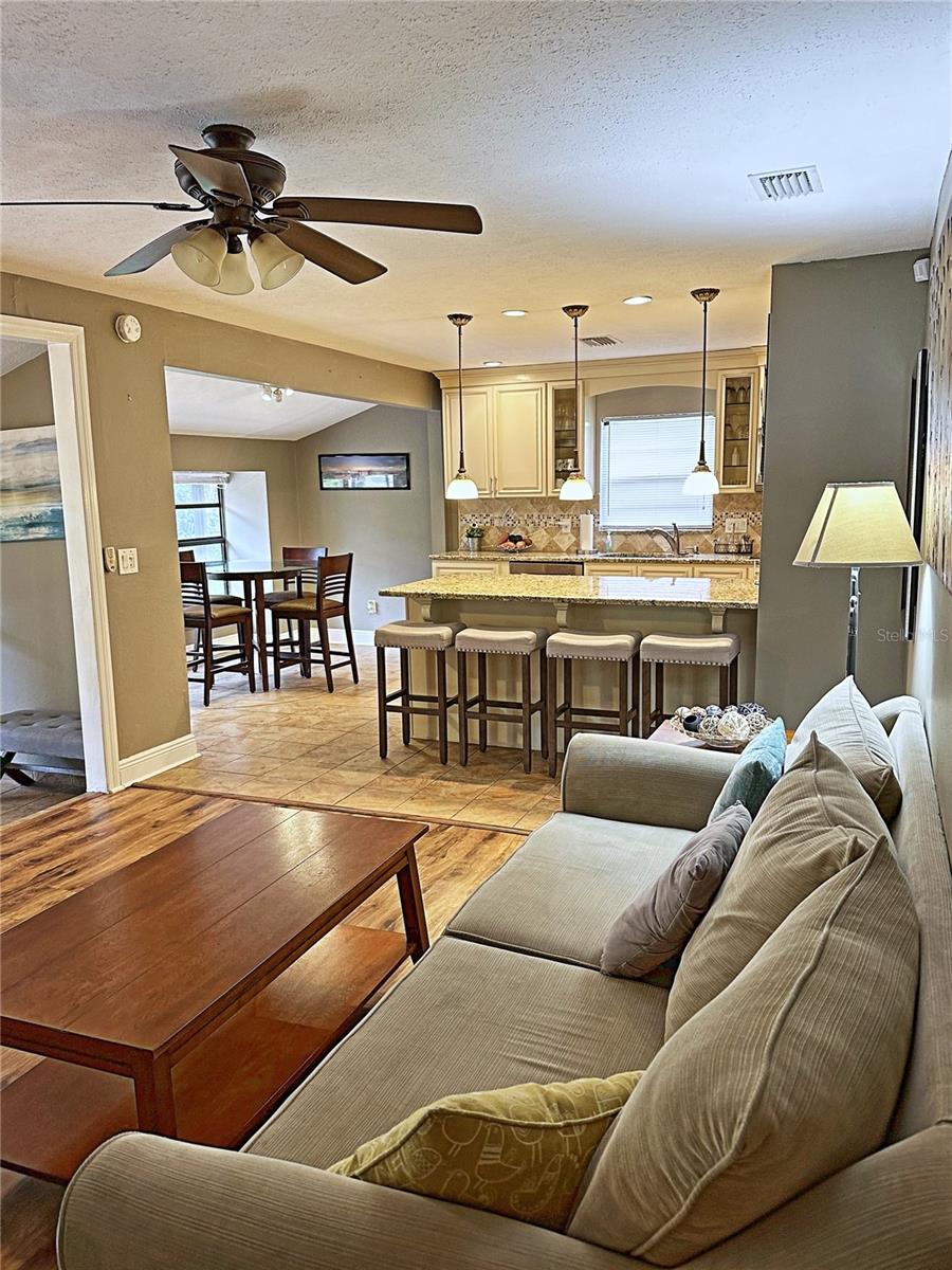 Living room facing the breakfast nook and kitchen bar.