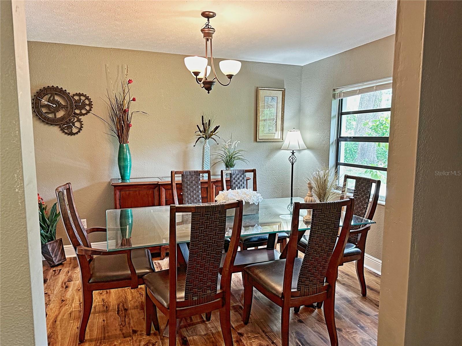 The dining room opens onto the kitchen and the living room.