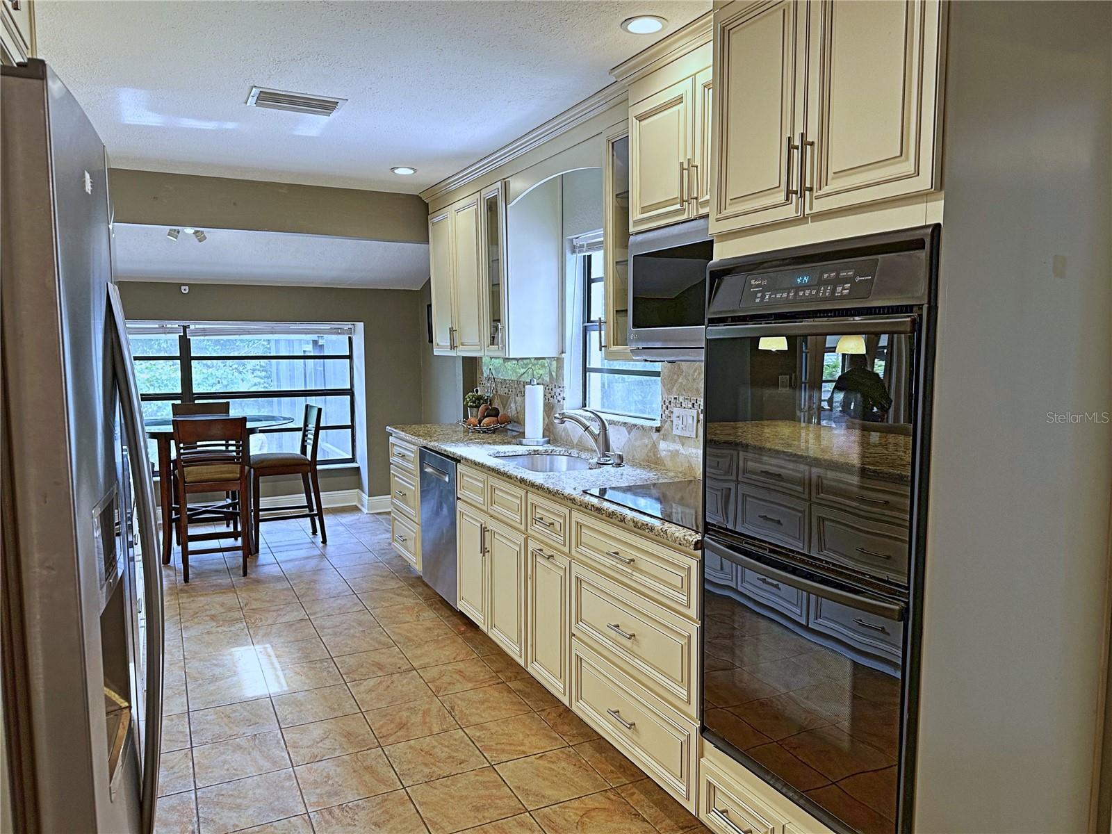 Note the double ovens and granite counter tops.