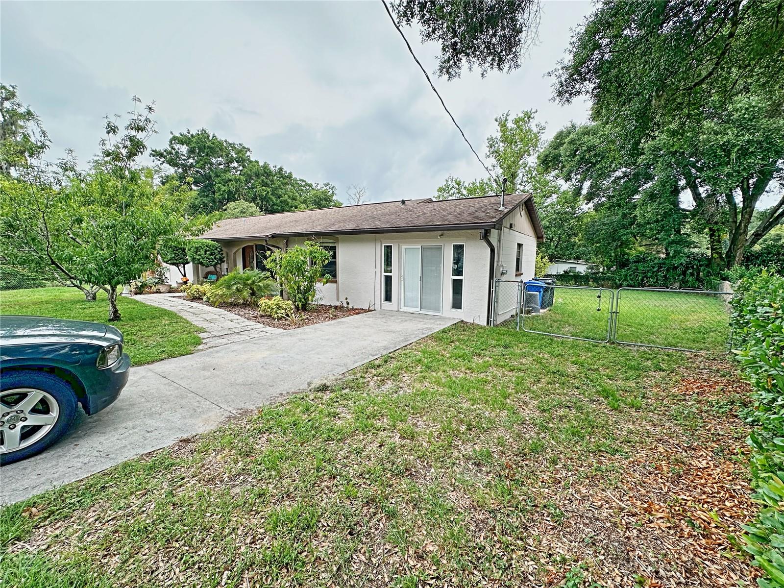 The back yard is pie shaped and has enough space for at least four trailers.  There is a drive path that has been used to store work trucks, boat and fifth wheel trailers.  The double gate allows for ease of access.