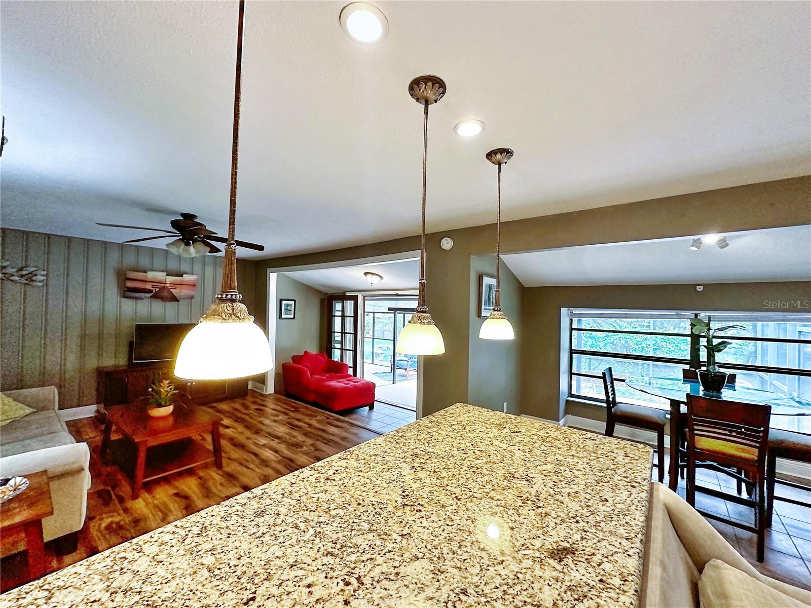 The kitchen island is a lovely granite.